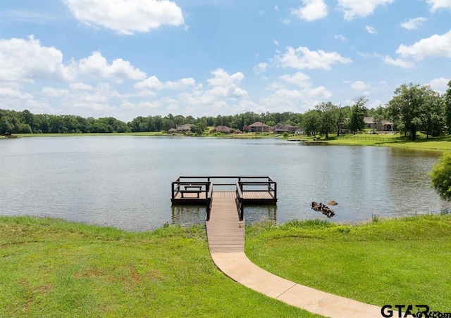 dock area featuring a water view and a lawn