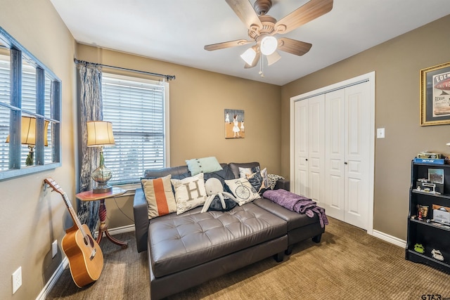 carpeted bedroom featuring ceiling fan and a closet