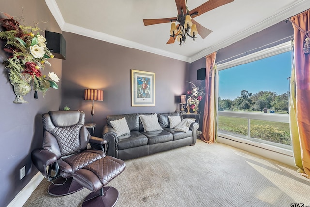 carpeted living room with ceiling fan and crown molding