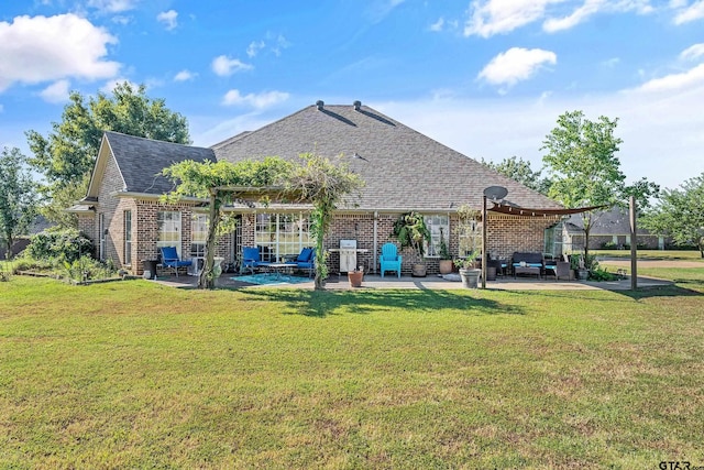 back of property featuring a lawn, a pergola, and a patio