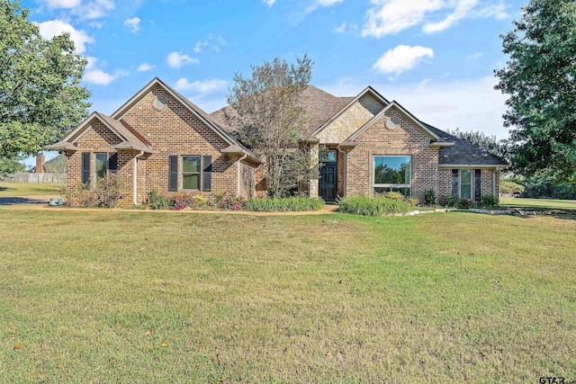 craftsman-style home featuring a front lawn