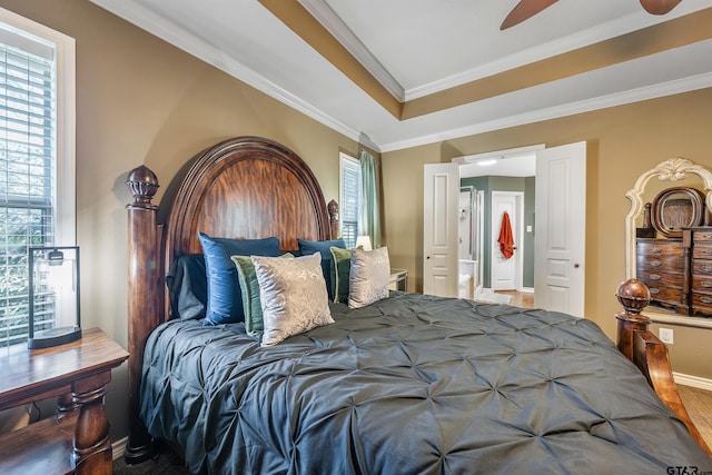 bedroom featuring hardwood / wood-style floors, ceiling fan, and crown molding