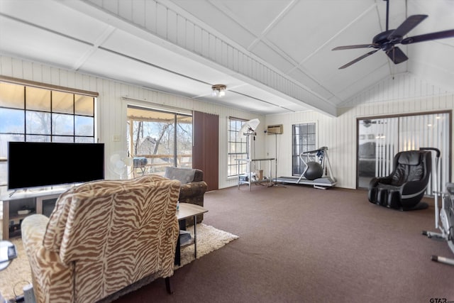 living room featuring carpet floors, ceiling fan, and vaulted ceiling