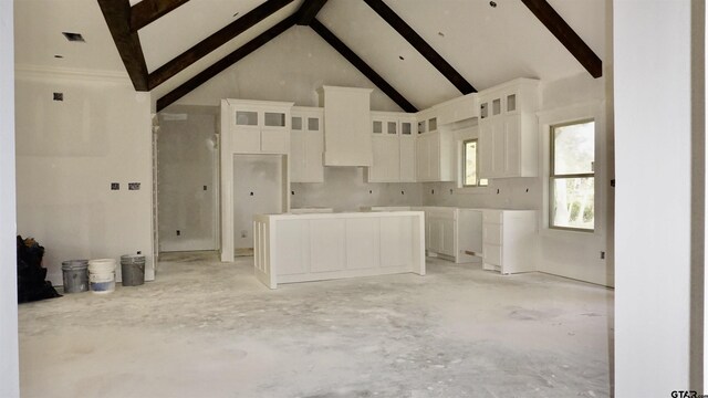 9422 Ann Ave, Tyler, TX 75706 - kitchen with beam ceiling, white cabinets, glass insert cabinets, and high vaulted ceiling
