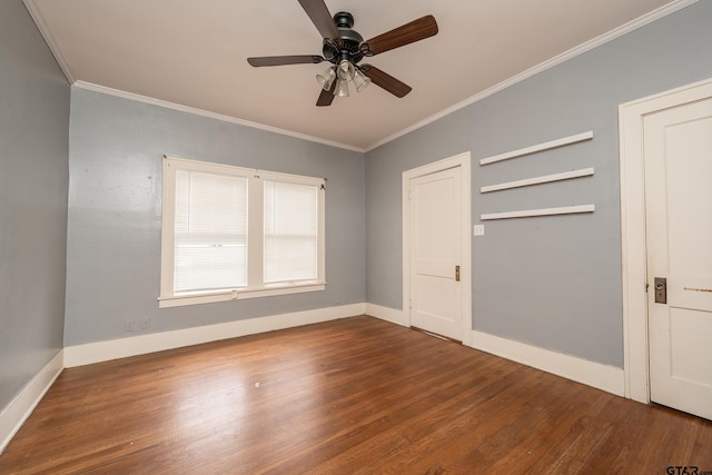 unfurnished bedroom with baseboards, a ceiling fan, wood finished floors, and crown molding