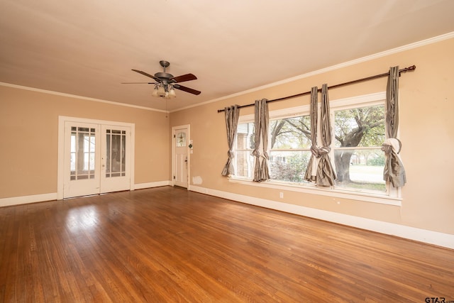 empty room featuring ornamental molding, wood finished floors, french doors, and ceiling fan