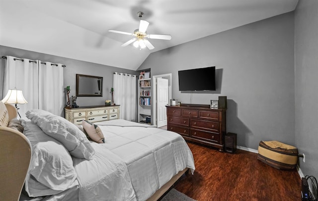 bedroom featuring a ceiling fan, lofted ceiling, baseboards, and dark wood-style flooring