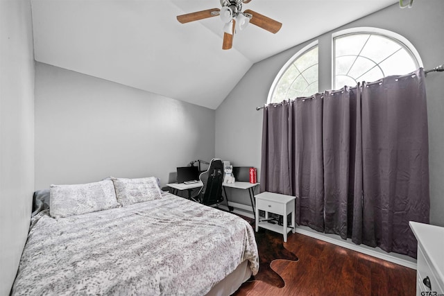 bedroom featuring ceiling fan, lofted ceiling, and wood finished floors