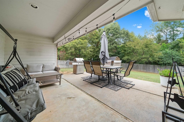 view of patio with a grill, outdoor lounge area, outdoor dining area, and a fenced backyard