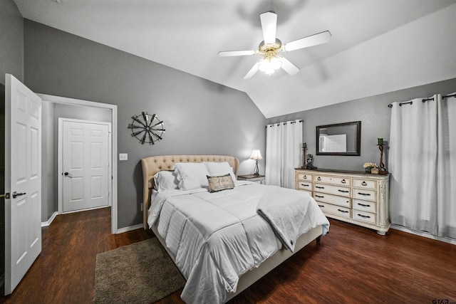 bedroom with ceiling fan, wood finished floors, baseboards, and vaulted ceiling