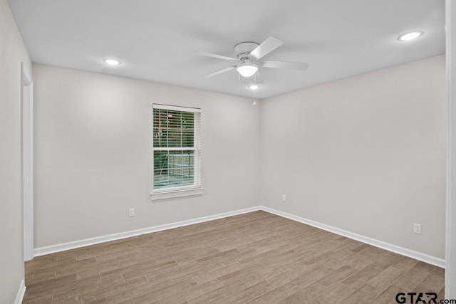 unfurnished room featuring ceiling fan and wood-type flooring