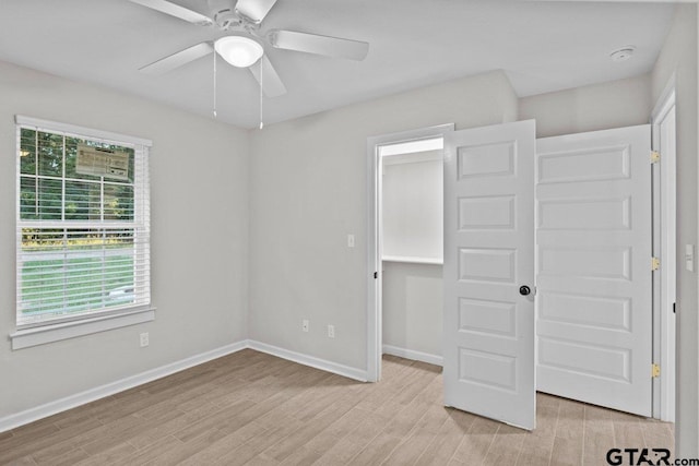 unfurnished bedroom with a closet, ceiling fan, and light hardwood / wood-style floors