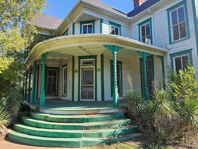 property entrance featuring covered porch