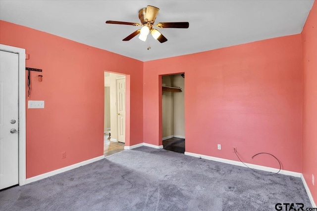 unfurnished bedroom featuring ceiling fan, a closet, and carpet