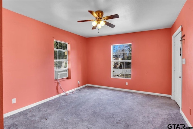 unfurnished room with ceiling fan, carpet, and cooling unit