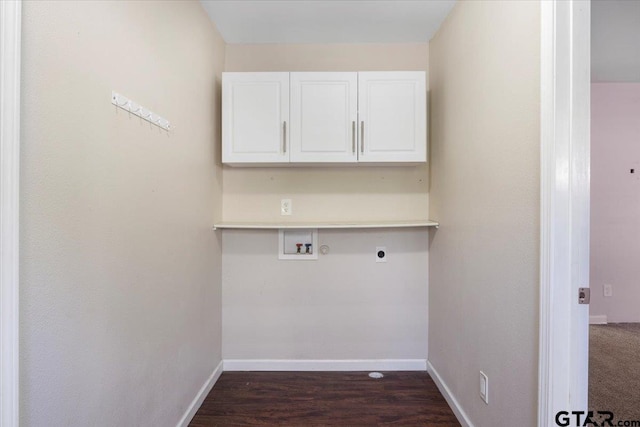 washroom featuring hookup for a washing machine, hookup for an electric dryer, dark wood-type flooring, and cabinets