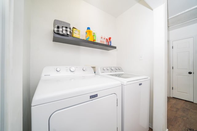 laundry room featuring washer and dryer, laundry area, and wood finished floors