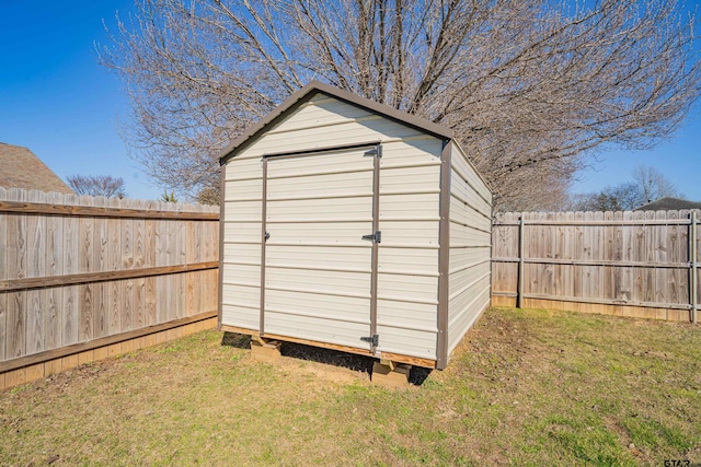 view of shed featuring a fenced backyard