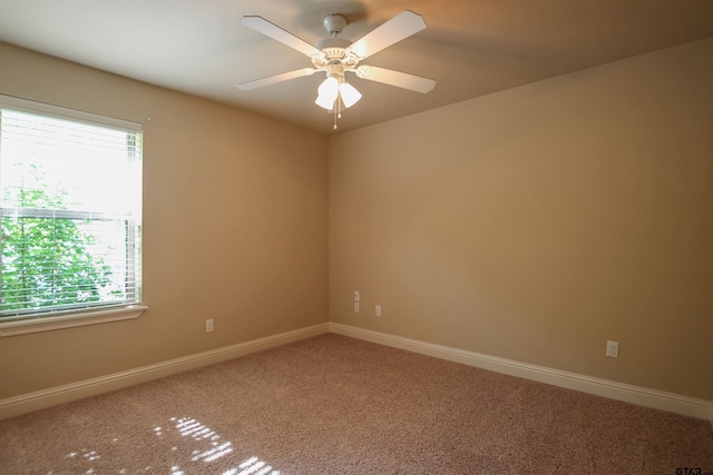 2559 Lazy Acres Ln, Tyler, TX 75707 - spare room with carpet, baseboards, and a ceiling fan