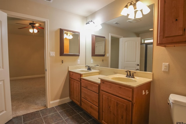 2559 Lazy Acres Ln, Tyler, TX 75707 - full bathroom with ceiling fan, tile patterned flooring, double vanity, toilet, and baseboards