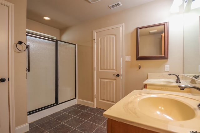 2559 Lazy Acres Ln, Tyler, TX 75707 - bathroom featuring a stall shower, tile patterned floors, double vanity, and recessed lighting