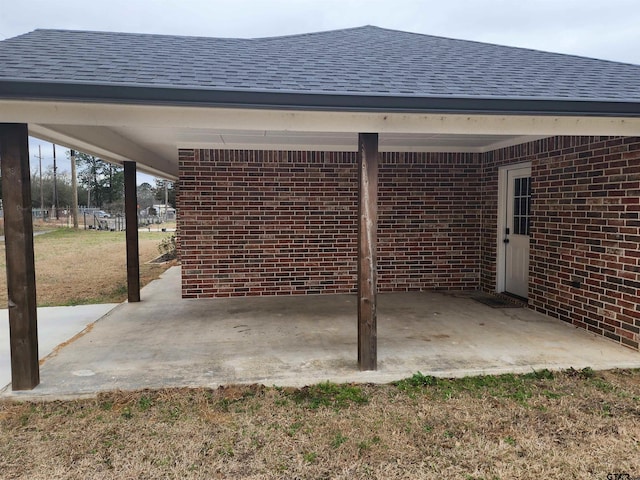 view of patio / terrace featuring an attached carport