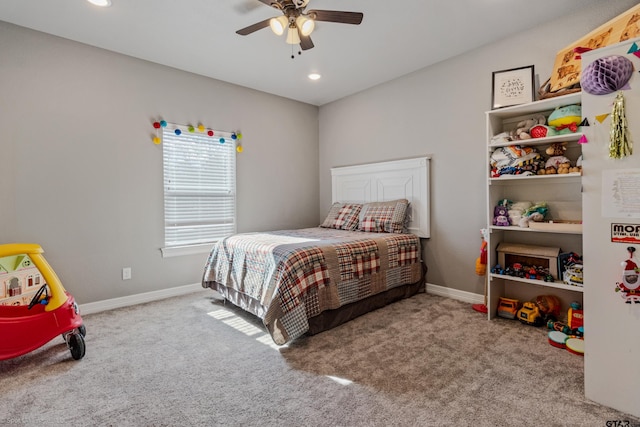 bedroom with light carpet and ceiling fan