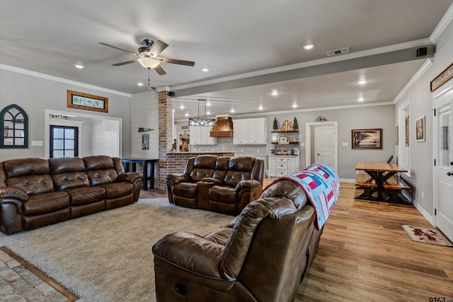 living room featuring ceiling fan, light hardwood / wood-style floors, and ornamental molding