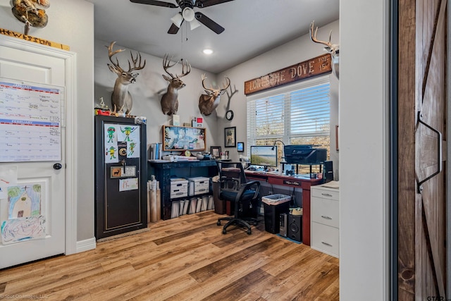 office space with ceiling fan and light hardwood / wood-style floors