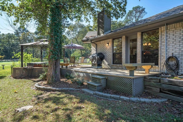 exterior space with a gazebo and a deck