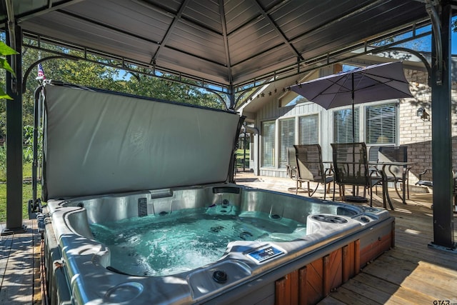 view of swimming pool with a gazebo and a deck