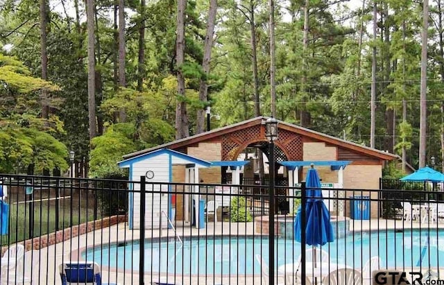 view of swimming pool with a patio area