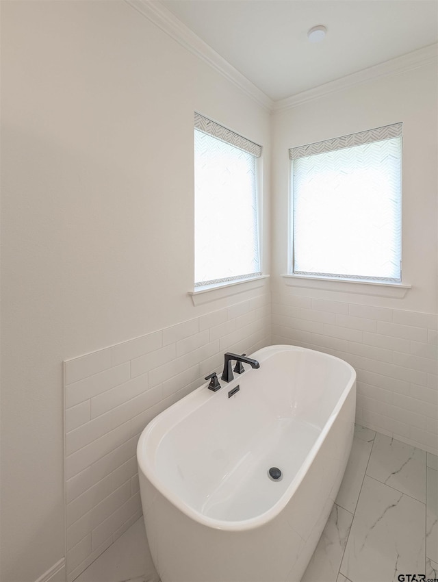 9070 Shallow Cv, Tyler, TX 75703 - bathroom with a soaking tub, marble look tiles, and crown molding