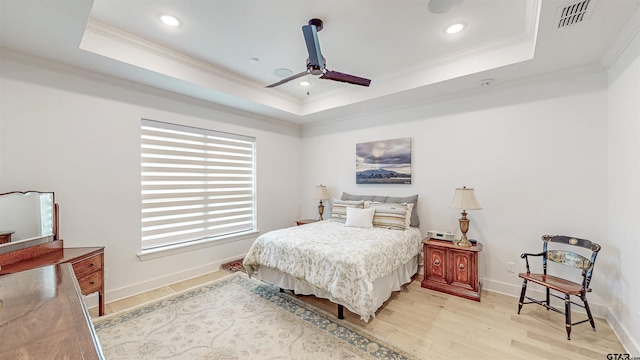 9070 Shallow Cv, Tyler, TX 75703 - bedroom featuring a tray ceiling, ornamental molding, light wood-type flooring, recessed lighting, and ceiling fan