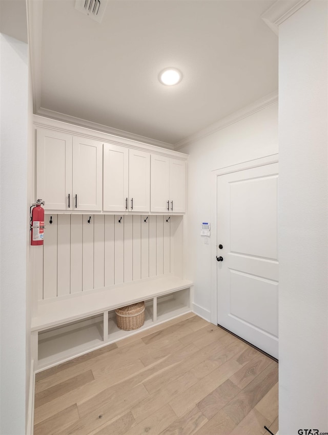 9070 Shallow Cv, Tyler, TX 75703 - mudroom with crown molding and light wood-type flooring