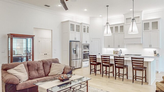 9070 Shallow Cv, Tyler, TX 75703 - living area with crown molding, light wood-style flooring, and recessed lighting