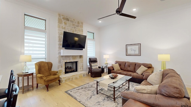 9070 Shallow Cv, Tyler, TX 75703 - living room with a fireplace, a ceiling fan, light wood-style flooring, ornamental molding, and recessed lighting
