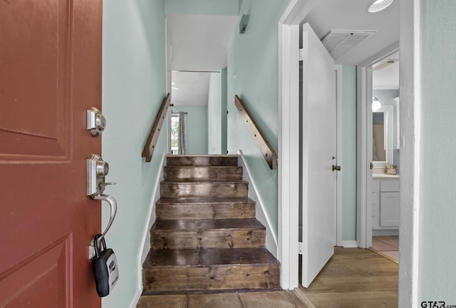 stairway with wood-type flooring