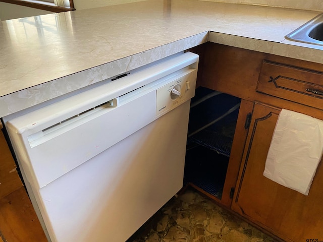 kitchen with light countertops and white dishwasher