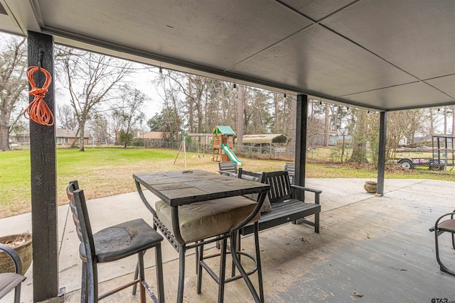 view of patio featuring a playground