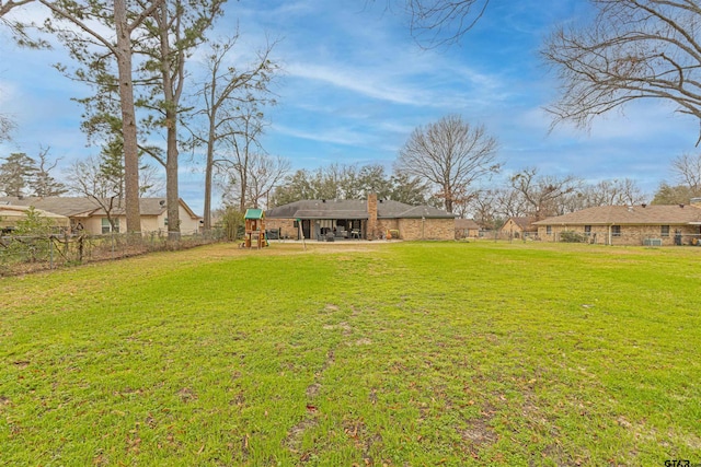 view of yard with a playground