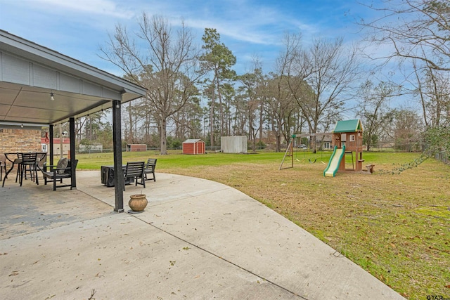 exterior space with a playground and a patio