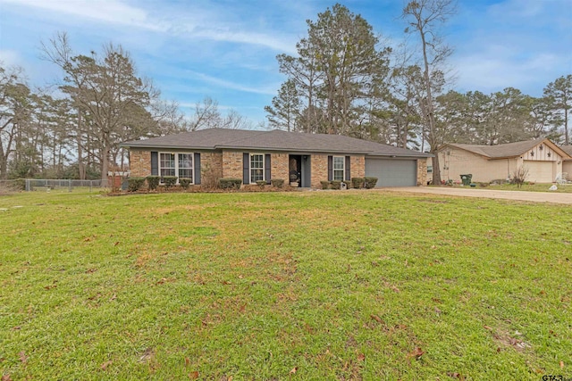 single story home with a garage and a front yard