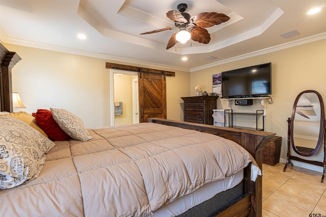 tiled bedroom featuring crown molding, ceiling fan, a tray ceiling, and a barn door