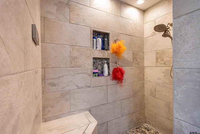 bathroom with tiled shower