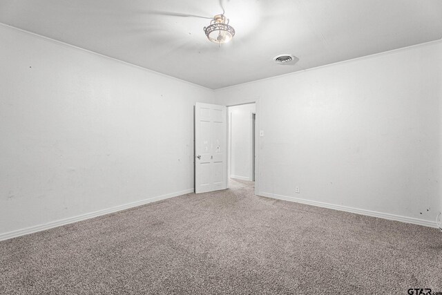 708 E Loftin St, Tyler, TX 75701 - carpeted empty room with ornamental molding