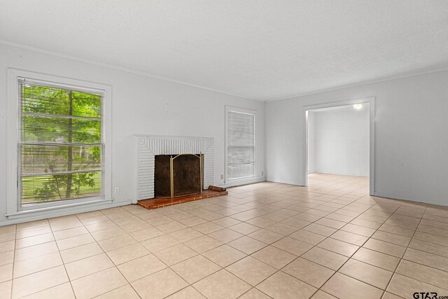 708 E Loftin St, Tyler, TX 75701 - unfurnished living room with a fireplace and light tile patterned floors