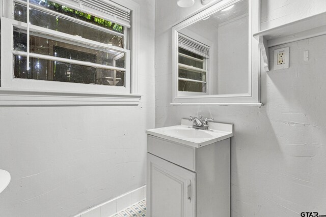 708 E Loftin St, Tyler, TX 75701 - bathroom with vanity and tile patterned flooring