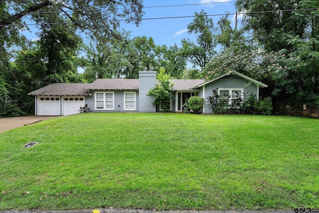 708 E Loftin St, Tyler, TX 75701 - ranch-style house featuring a chimney, a garage, a front lawn, and driveway