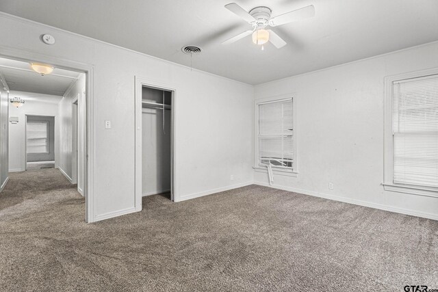 708 E Loftin St, Tyler, TX 75701 - unfurnished bedroom with carpet floors, a closet, crown molding, and a ceiling fan